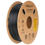 Creality Hyper Series PLA-CF matte black 3D printer filament on a cardboard spool with product label and QR codes