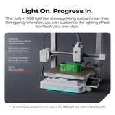 SPARKX i7 printing a green part with a teal RGB light bar and a list of status light colors on the left