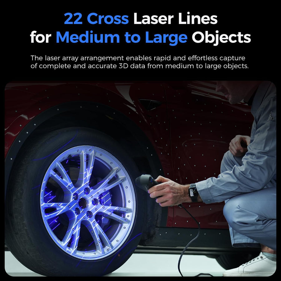 Technician scanning a car wheel with the Raptor Pro handheld scanner as blue cross laser lines cover the rim